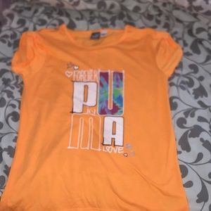 a orange puma shirt
